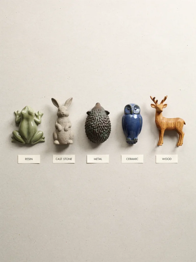 A flat lay or side by side grid showing five garden animal statues, one each in resin, cast stone, metal, ceramic, and wood, to visually compare textures and finishes.