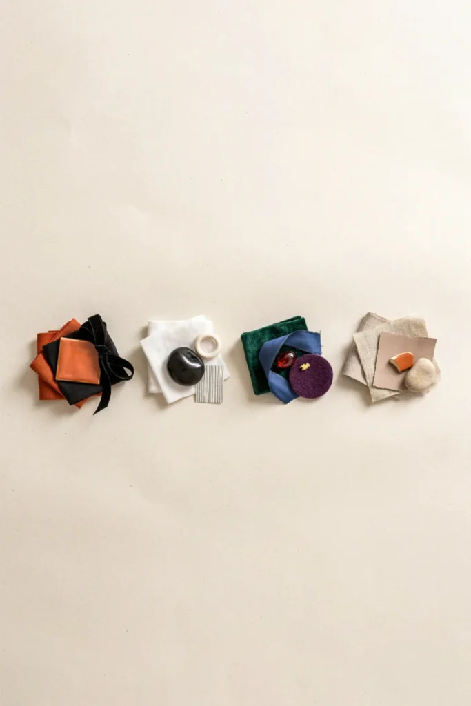 Four small color swatch groupings displayed side by side, classic orange and black, black and white, deep jewel tones, and muted neutrals with orange accents, clean styled flat lay